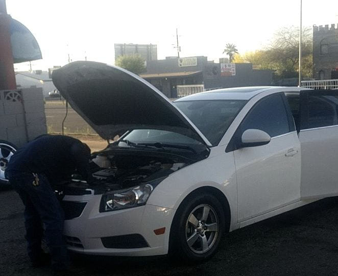 Mechanic working on car